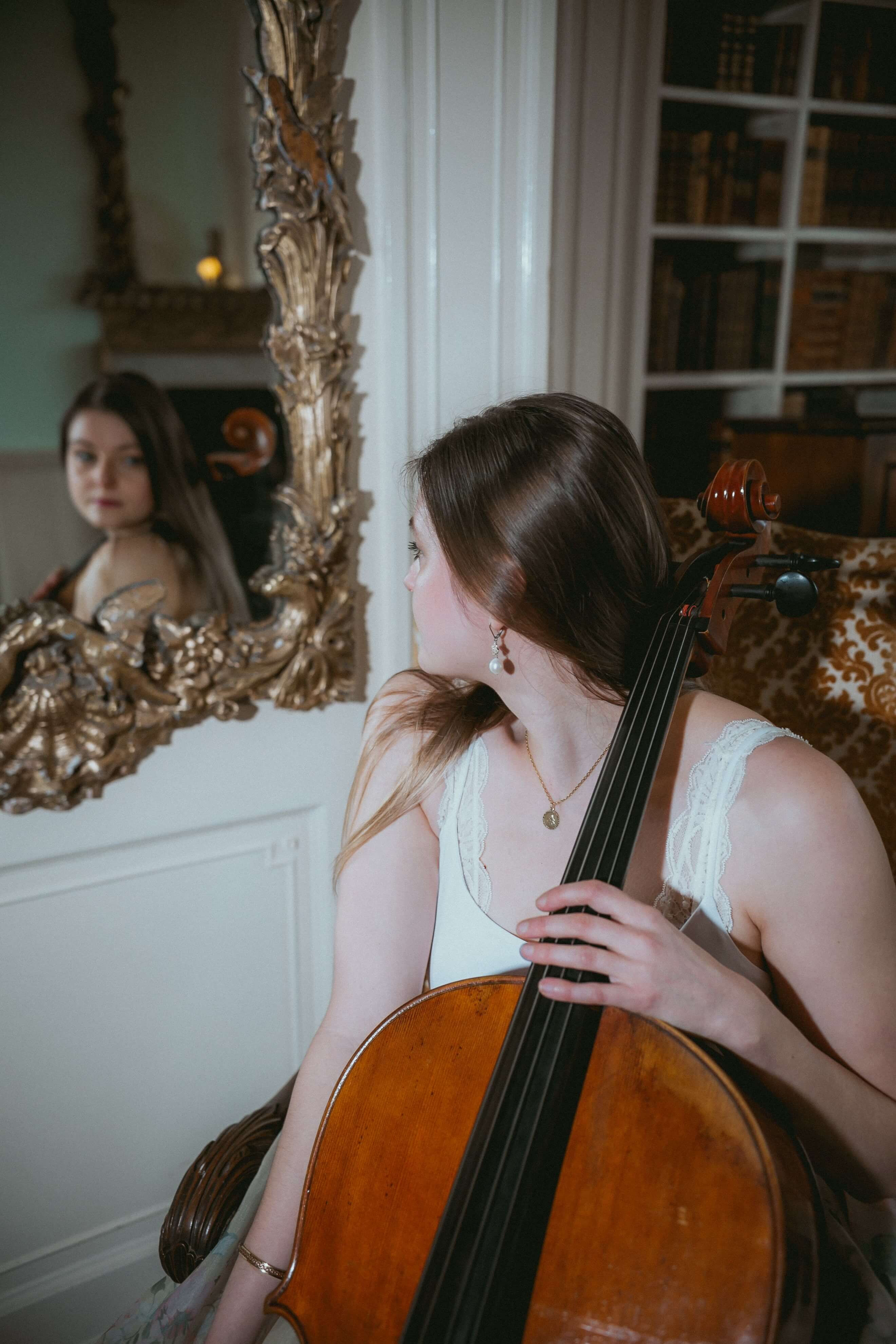 Wedding cellist in Wales captured in a mirror reflection