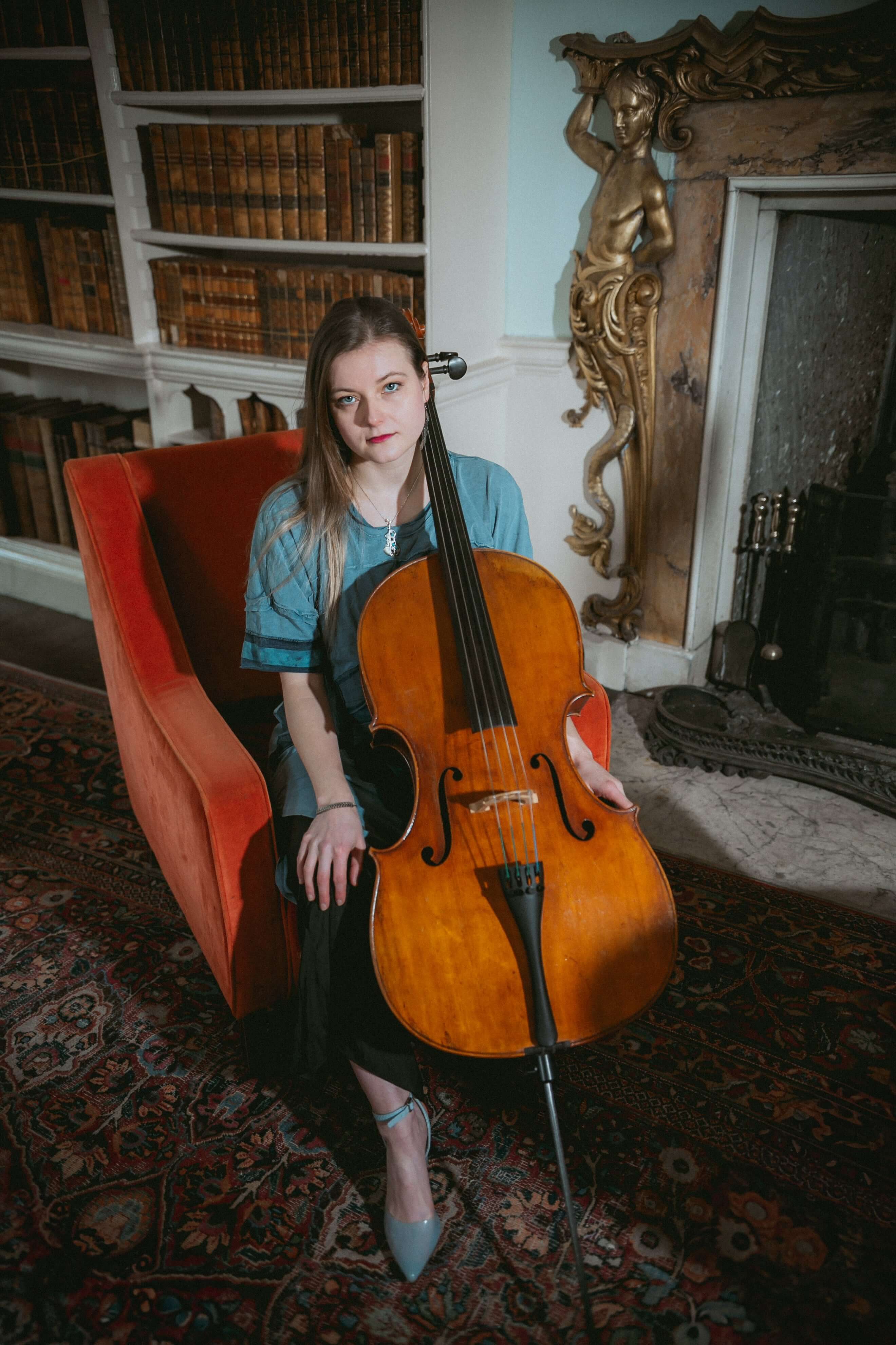 Portrait of a Welsh wedding cellist wearing a blue outfit